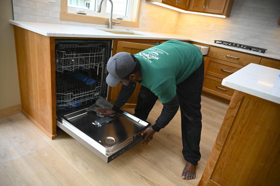 Man cleaning oven